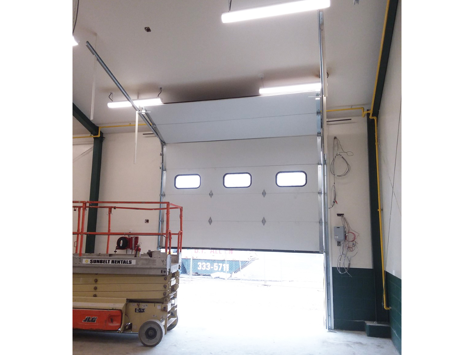 Overhead sectional door with small windows - carlplacehs