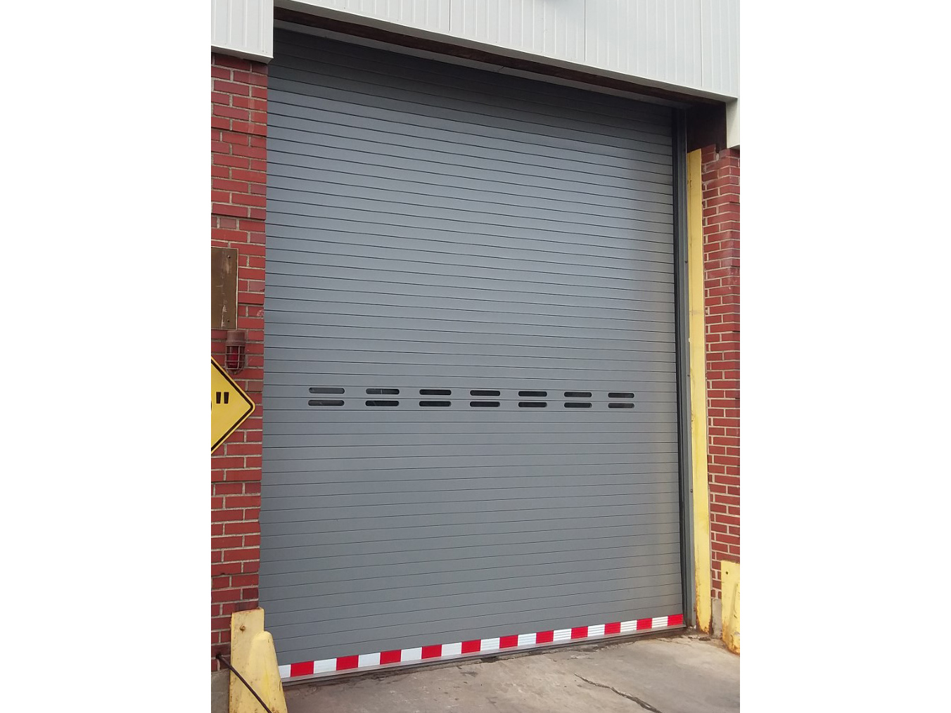 Punched slat rolling door - coned_middletown